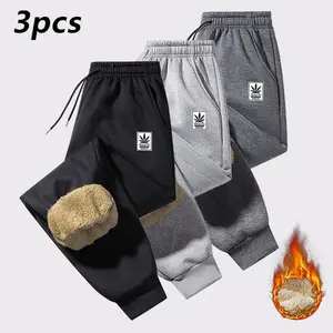 Men's thick warm sweatpants, autumn and winter outdoor casual long pants with floral print, elastic drawstring waistband, machine washable polyester fiber, solid color design, fleece lining for warmth, suitable for cold weather and everyday casual wear