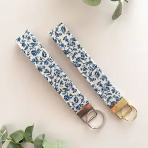 Blue Floral Keychain Wristlet with Elegant Gold and Silver Buckles for Stylish Accessory