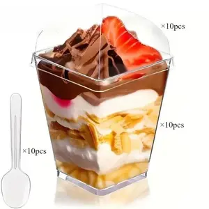 These 10-piece square reusable plastic cups have a pavilion-shaped top, come with a lid and spoon, and are transparent, making them perfect for parties, including yogurt ice cream, cream cakes, weddings, birthdays, Christmas, and Eid celebrations.