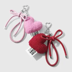1 piece Instagram-style creative, sweet, fashionable, versatile casual minimalist pink/red leather wrist strap with bow, plush heart and peach heart charms; DIY keychain accessory and bag charm; suitable for girls, women, sisters, and best friends for eve