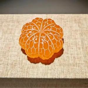 Oriental Gold Frozen Stone ornament, handheld piece, spinning craft item, souvenir gift, stress-relief spinning, hanging decoration, orange ornament