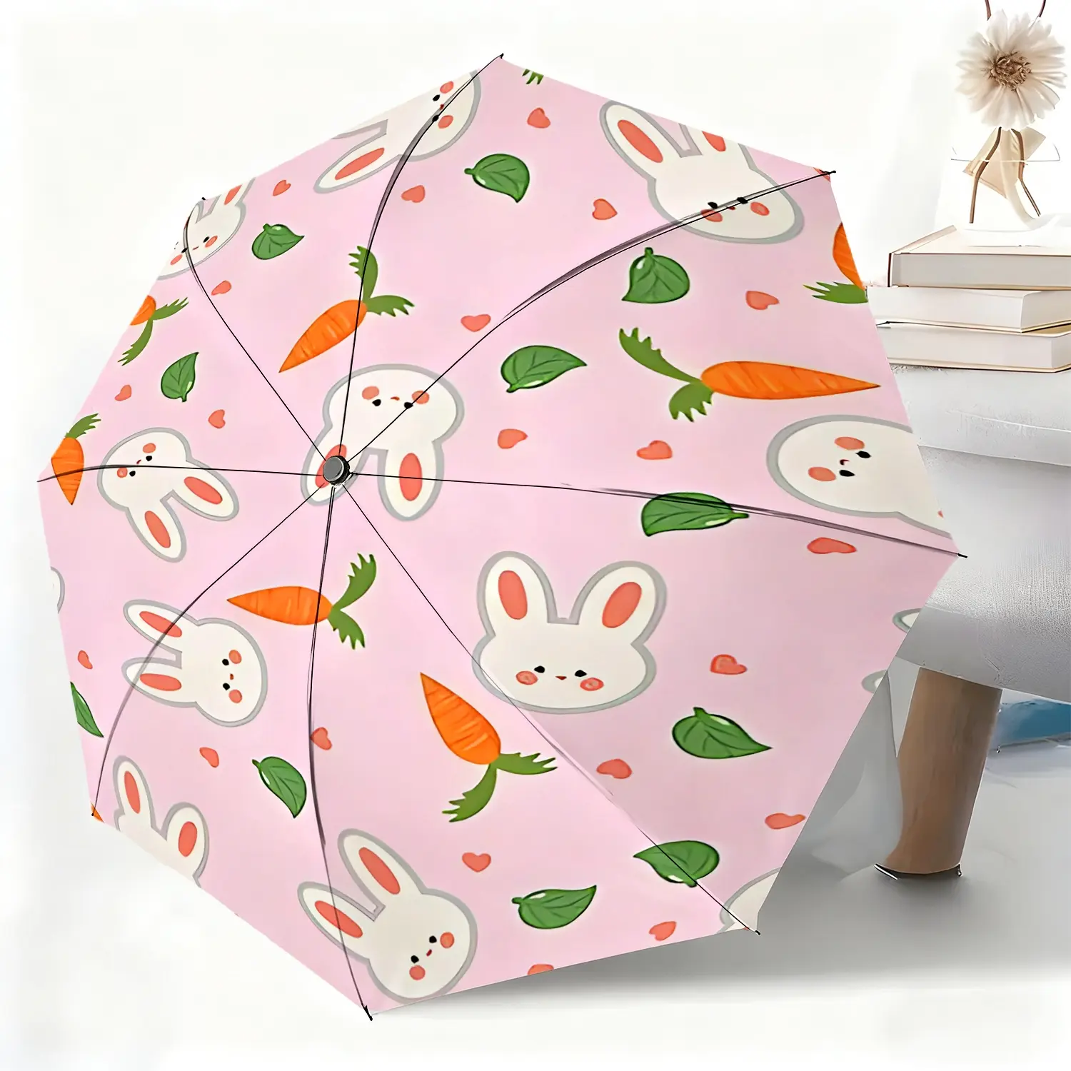 This waterproof folding umbrella features a rabbit, carrot, and green leaf print design, suitable for both men and women, and is portable for travel and everyday use.