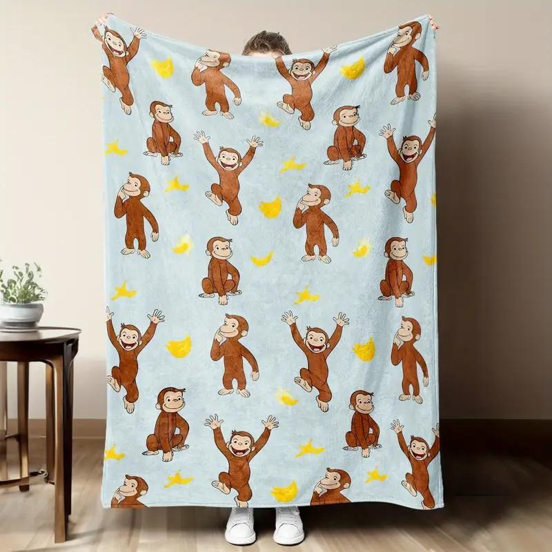 digital printed flannel Warm Throw Blanket with a Curious George monkey and banana pattern, suitable for sofas, beds, travel, camping, and office use. Made of warm, comfortable, and soft fabric, machine washable, for birthday and holiday gifts