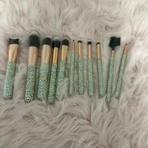 Makeup Brushes with Sparkling Handles and Gold Accents for Cosmetic Application