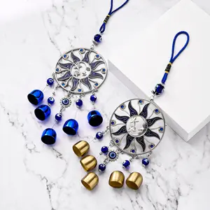Wind Chime with Blue "Evil Eye" — Hanging Bell Ornament featuring Stars, Moons, and the Evil Eye Motif