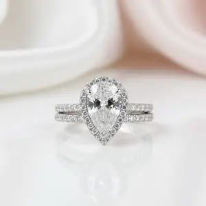 Halo Pear Cut White Sapphire Wedding Ring Set In White Gold