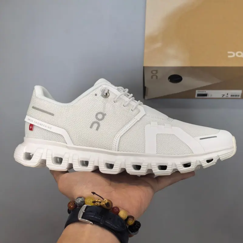 Retro running sneakers with flexible segmented shock-absorbing athletic silhouette, premium breathable knit mesh finished in crisp off-white paired with matching solid trim accents, hollow pure white foam midsole