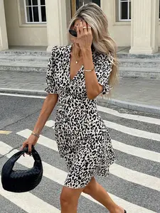 A women's leopard print V-neck puff sleeve fitted short dress, featuring a sexy vintage fashion style, suitable for casual occasions that showcase personal charm, such as dates, city street outings, or small social gatherings, Casual Chic Dress