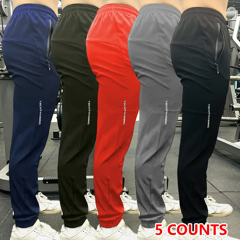 Men’s jogging pants 5-piece set with zippered pockets, made from lightweight moisture-wicking fabric, perfect for year-round workouts and casual wear.