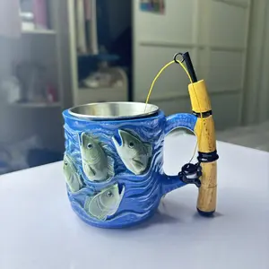 Fishing-themed mug with a 3D fish shape and fishing rod handle; a reusable gift for anglers, perfect for fathers and husbands, suitable for family bars, camping occasions, or Father's Day for fishing enthusiasts.