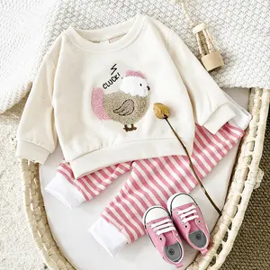 Two-piece spring/autumn baby outfit: warm apricot-colored sweatshirt with cartoon appliqué patches + loose long pants with pink and white stripes; a cute infant set for babies and toddlers (top and bottom only, no shoes, hats, or other accessories include