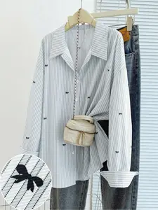 White fine-striped long-sleeve shirt with black bow detail.Blends French sweetness and Korean casual style.Perfect for daily outings, commuting, dates, afternoon tea and vacations. Blouse