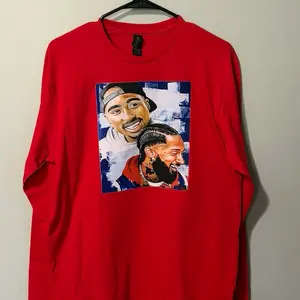 Red T-Shirt with Bold Graphic Design Featuring Iconic Figures for Streetwear Enthusiasts