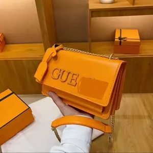 Orange Crossbody Bag with Chain Strap and Logo Detailing for Women's Fashion