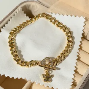 Cuban style bracelet with zirconia clasp and butterfly charm