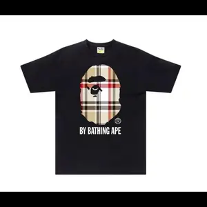 BAPE A Bathing Ape Check by Bathing Tee Black T-Shirt with Iconic Ape Head Design and Plaid Pattern for BAPE Enthusiasts