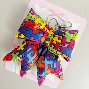 Autism Awareness Puffy Bow Keychain with Colorful Puzzle Piece Design for Awareness Support