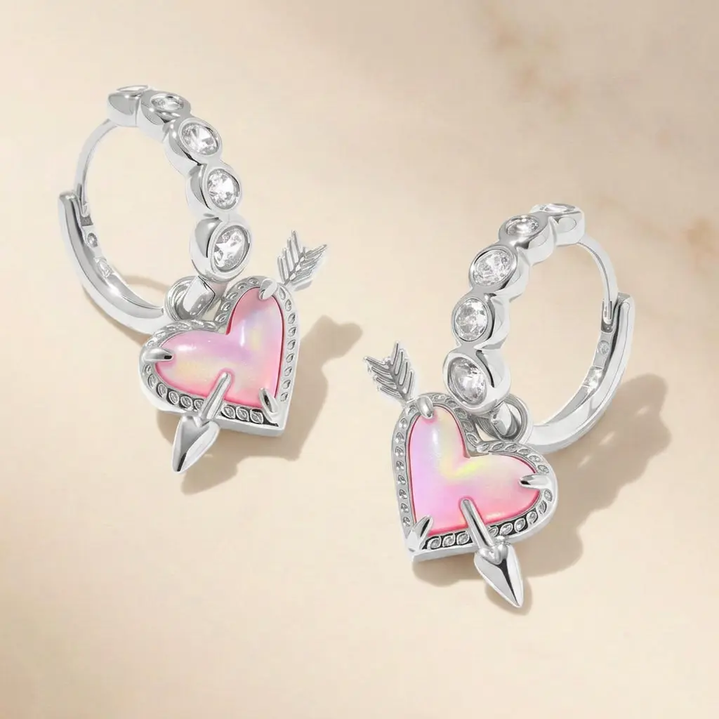Kendra Scott huggie earrings feature adorable heart-arrow design with fine polished finish, perfect for daily wear and gifting, add sweet edgy romantic flair to women's everyday looks.
