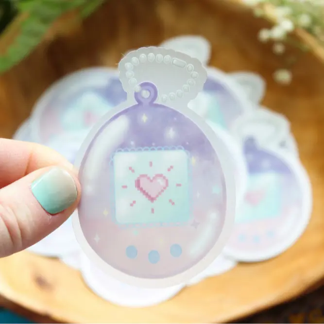 Tamagotchi Inspired Clear Waterproof Vinyl Sticker | Daybreak | Matte Finish | Nostalgic | 2000s Merch | 90s Kids | Celestial | Pastels | 3" x 2"
