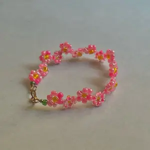 Cherry Blossom Bracelet - Pink Beaded Design with Yellow Accents and Gold Charm