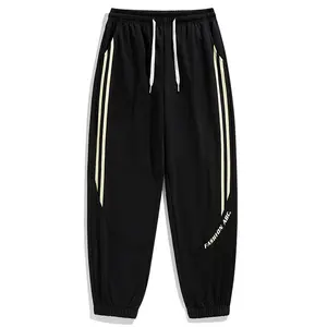 Men’s jogger sweatpants with side double stripe pattern, casual long pants, trendy athletic joggers