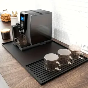 2-in-1 silicone coffee mat with raised edges, measuring 23.6x15.7 inches, designed to protect your coffee countertop. Suitable for coffee machines and drip dryers, featuring a non-slip design and removable absorbent pad
