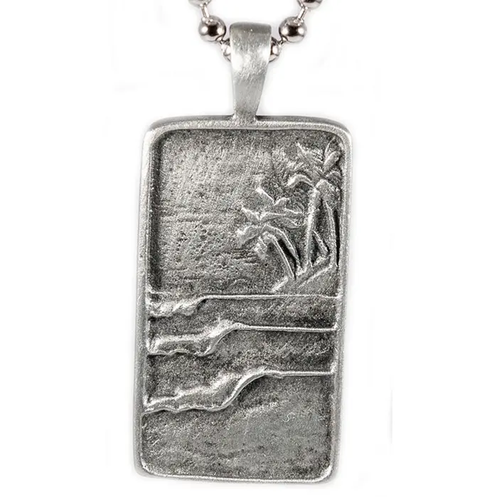 The Surf Tag Necklace by Strickly Boarding and Joe Paradise.  Elegant Handmade Jewelry for Ocean Lovers Unique Surfing Accessory with perfect waves under a tropical backdrop.