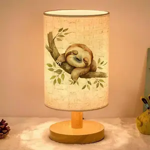 This ambient table lamp features a watercolor-style sleeping sloth design. Powered by USB, it's a Led Table Lamp, Decorative gentle lamp, suitable for home decor and makes a perfect gift for family and friends during holidays