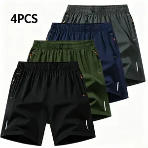 Four piece set of military green sports shorts, featuring a stylish athletic design with an elastic waistband for added comfort and fashionability. The fabric has a fine texture, providing a structured look without being soft or saggy. Pairs well with a t