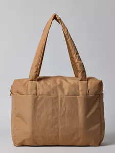 BAGGU Small Cloud Carry-On Travel Bag Heavyweight Nylon 59% Recycled with Tech Pocket for 16" Laptop and Side Pockets for Water Bottle and Boarding Pass