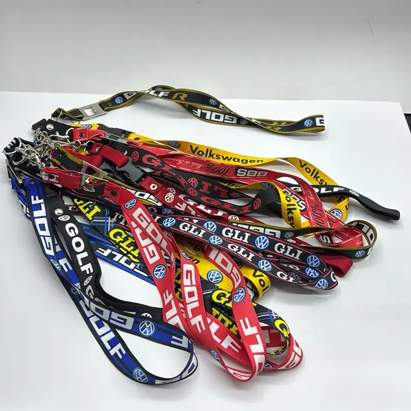Volkswagen-branded lanyards in various styles, featuring "GOLF" and "GLI" logos. These accessories are made of fabric and include metal accents and quick-release clasps.
