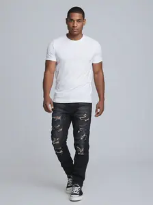 Men’s Black Ripped Denim Jeans – Casual Long Pants with Multiple Holes and a Mustard Yellow Hole Detail
