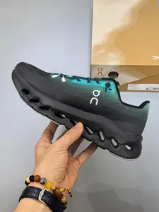 Obsessed with this sleek black and teal gradient running sneaker, ultra-lightweight and responsive for workouts and streetwear