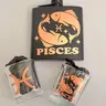 Pisces Zodiac Flask Set – Rose Gold Edition Product Highlights - Includes: 1 Pisces flask (6 oz), 2 square shot glasses (2 oz each), 1 mini funnel - Rose gold metallic detailing with Pisces glyph, Pisces symbol, - Matte black stainless Steel