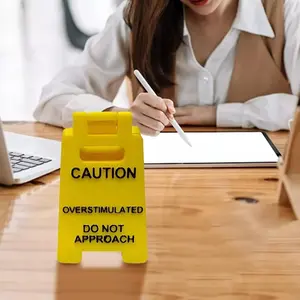Caution Overstimulated Desk Sign - Yellow Sign with Black Text, Humor Gag Gift for Coworkers, Boss & Employees, Mini Novelty Desk Decor, Home Office Decoration, Funny Gifts