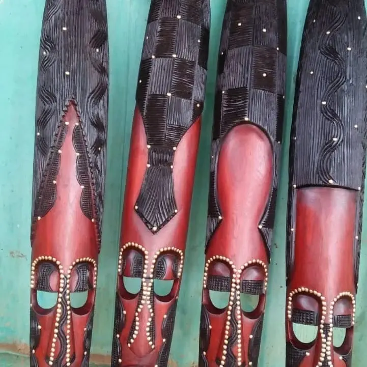 African Wood Carvings with Intricate Designs and Beaded Accents for Unique Decor