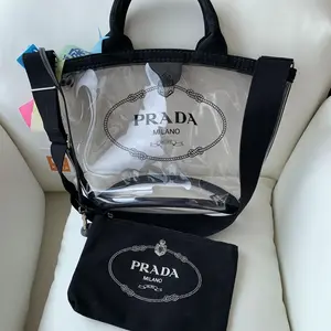 Pre-owned PRADA Transparent PVC beach bag with black strap & black embroidery, comes with a pouch, casual & elegant style.WJ01110605