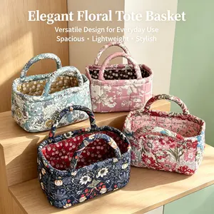 Small quilted storage basket with large floral pattern, vintage floral design, wear-resistant molded construction, handheld desktop design, portable—ideal for storing small miscellaneous items.