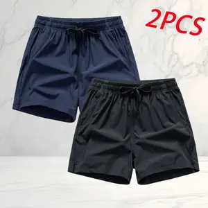 Men’s summer athletic shorts, two-pack, American casual sporty style. Quick-dry, breathable fabric keeps you cool and wicks away sweat. Zippered pockets securely hold a phone, and a drawstring waistband is loose and doesn’t squeeze. A relaxed fit prevents