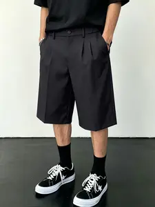 American retro collegiate black suit shorts — campus trend, everyday casual lightweight design, loose fit, streetwear/high street style, smart-casual commuter office versatile piece, minimalist relaxed look; men’s black pleated wide-leg suit shorts.