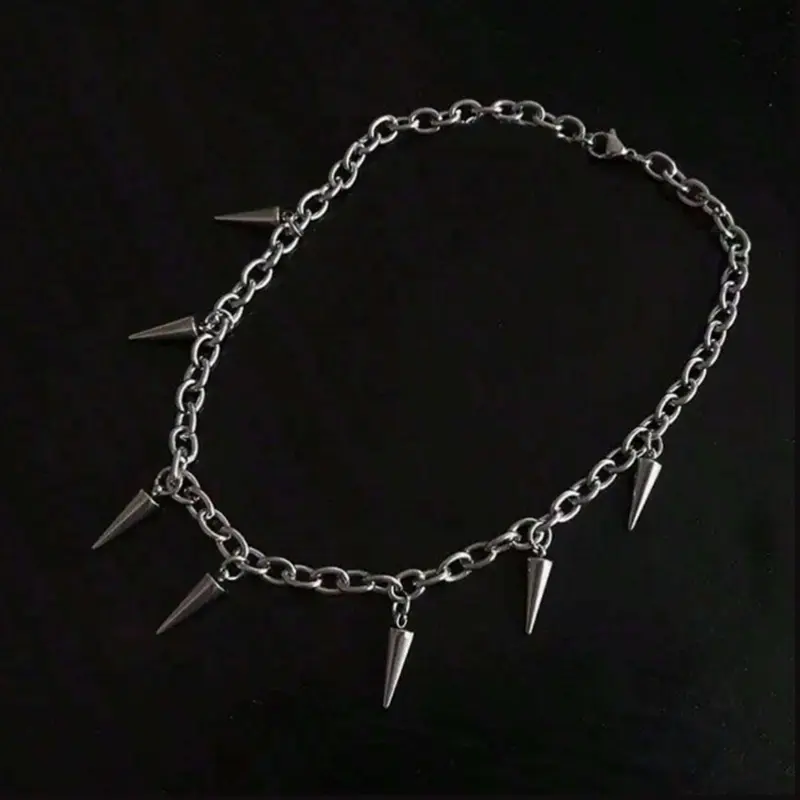 Spiked chain necklace  - A silver chain necklace with multiple spike pendants for a bold, edgy look.