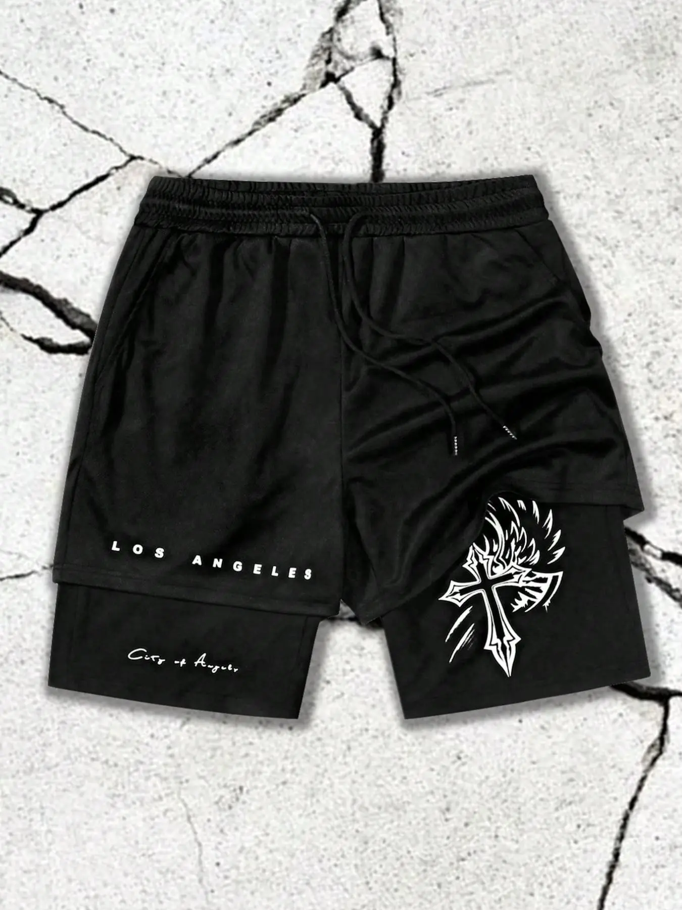 Men’s sports fitness shorts featuring a Los Angeles “City of Angels” cross-stitch print on a faux two-piece athletic short. Street Gothic attire, drawstring waistband, comfortable black shorts – essential for summer fitness and running.