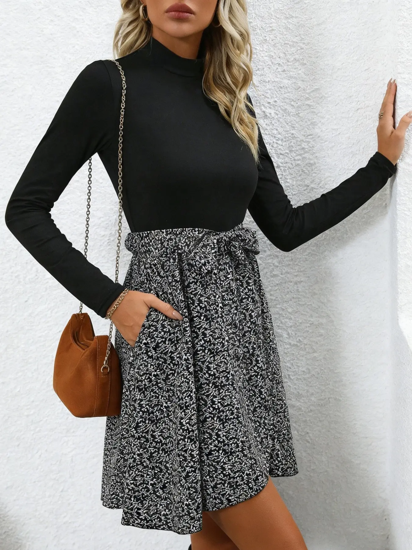 A fashionable women's black and white spliced high neck dress with layered design and a high waisted tie for commuting, shopping, and outdoor wear