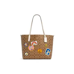 COACH x Snoopy City 33 Tote Bag in Khaki with Signature Canvas and Faux Leather for Women