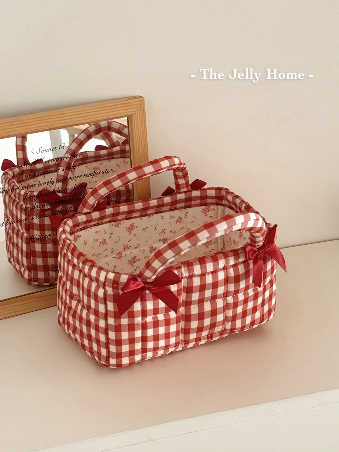 A student dorm essential: small red grid stitched desktop storage basket — compact fabric organizer with butterfly accents, space-saving mini basket for pens, snacks, and cosmetics; ideal for dorm desktop organization.