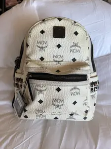Pre-owned MCM Leather Backpacks White Logo Print Mini Backpack with Black Accents