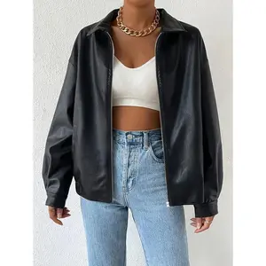 Women’s solid leather jacket with a full zip, drop shoulders, lapels, and long sleeves; casual fitted minimalist outerwear available in black and brown.