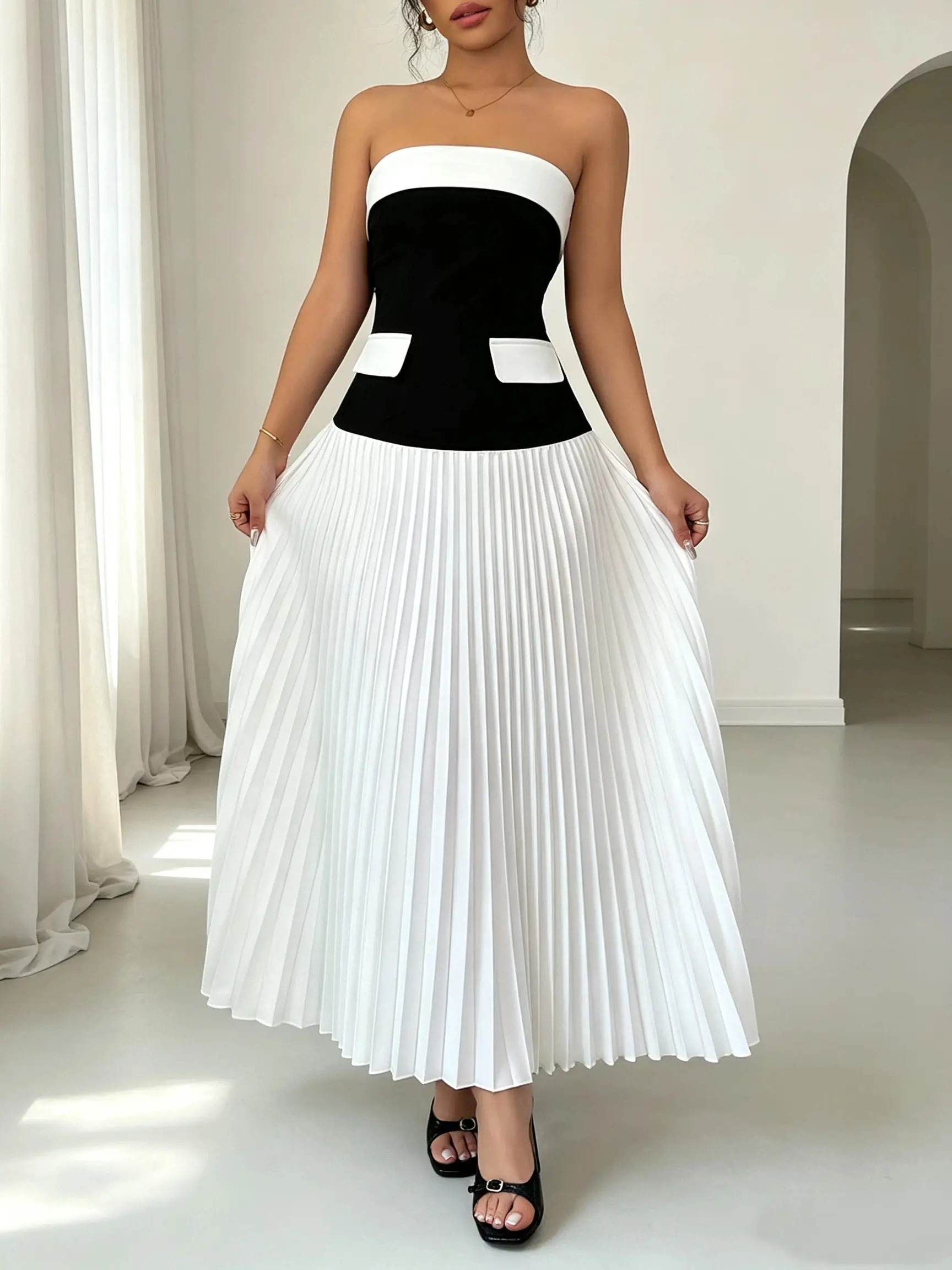 Elegant women’s strapless black-and-white color-block formal dress featuring a cinched waist and pleated design; a long dress suitable for evening dinners, dates, vacations, and travel. Fabric Womenswear