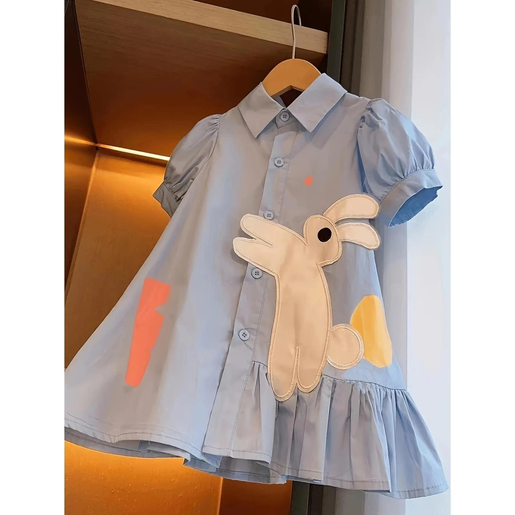 Easter New Summer Collection Features a Cute Asymmetrical Pleated Shirt Dress with a Rabbit Pattern And a Small Collar, Embodying a Charming School Style with Short Sleeves