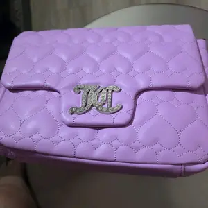 Juicy Couture New Genuine w/tags Backpk Bag with Embossed Branding and Zipper Closure